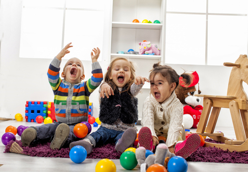 three-kids-playing-with-colorful-balls.jpg